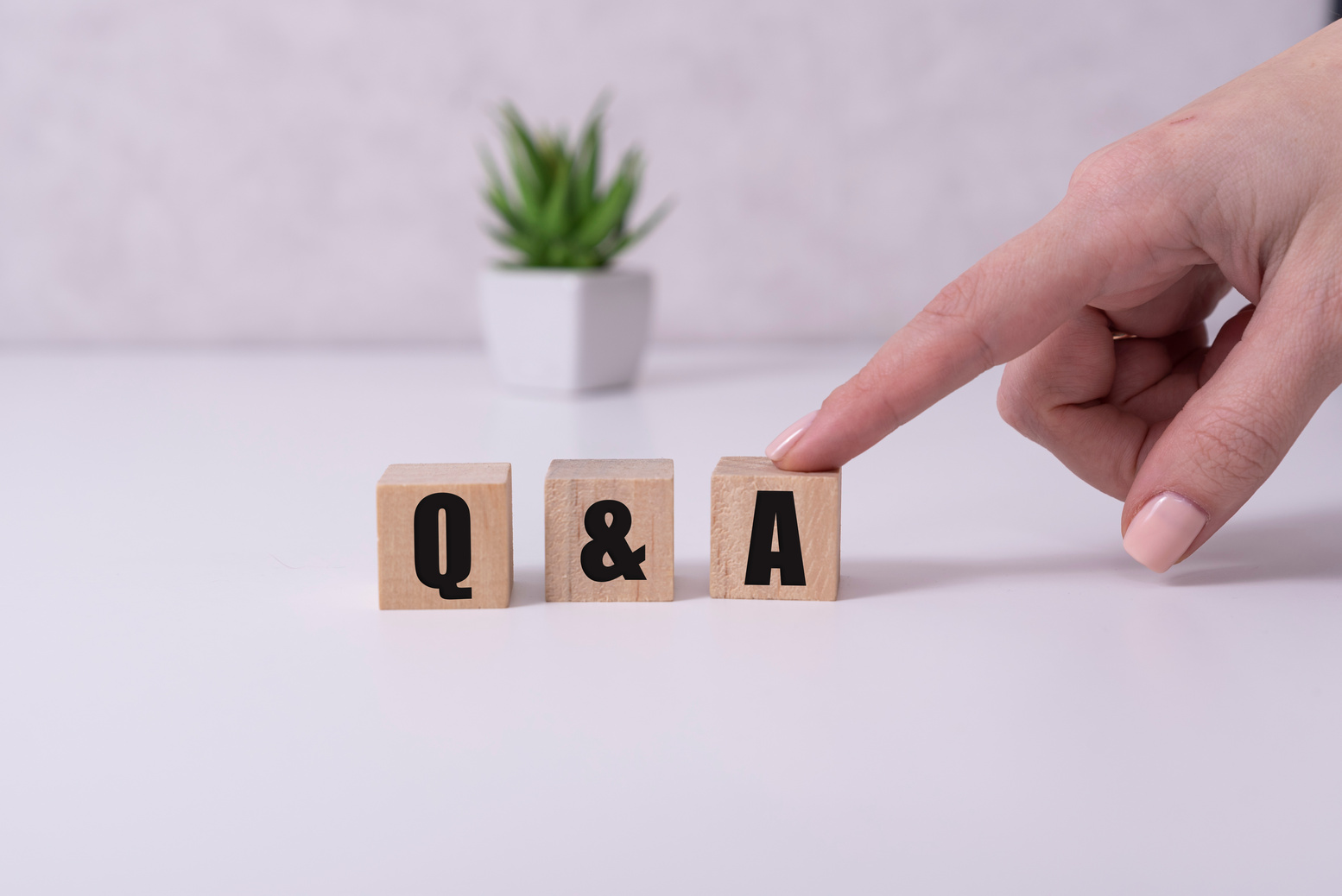 Close-up Shot of Q and A wooden blocks.